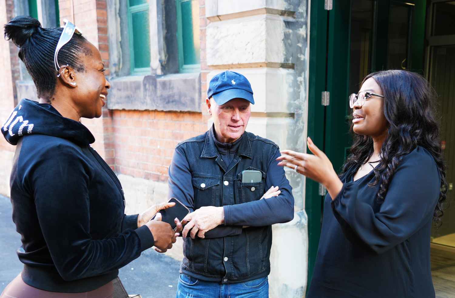 Commissioner talking to two members of the public
