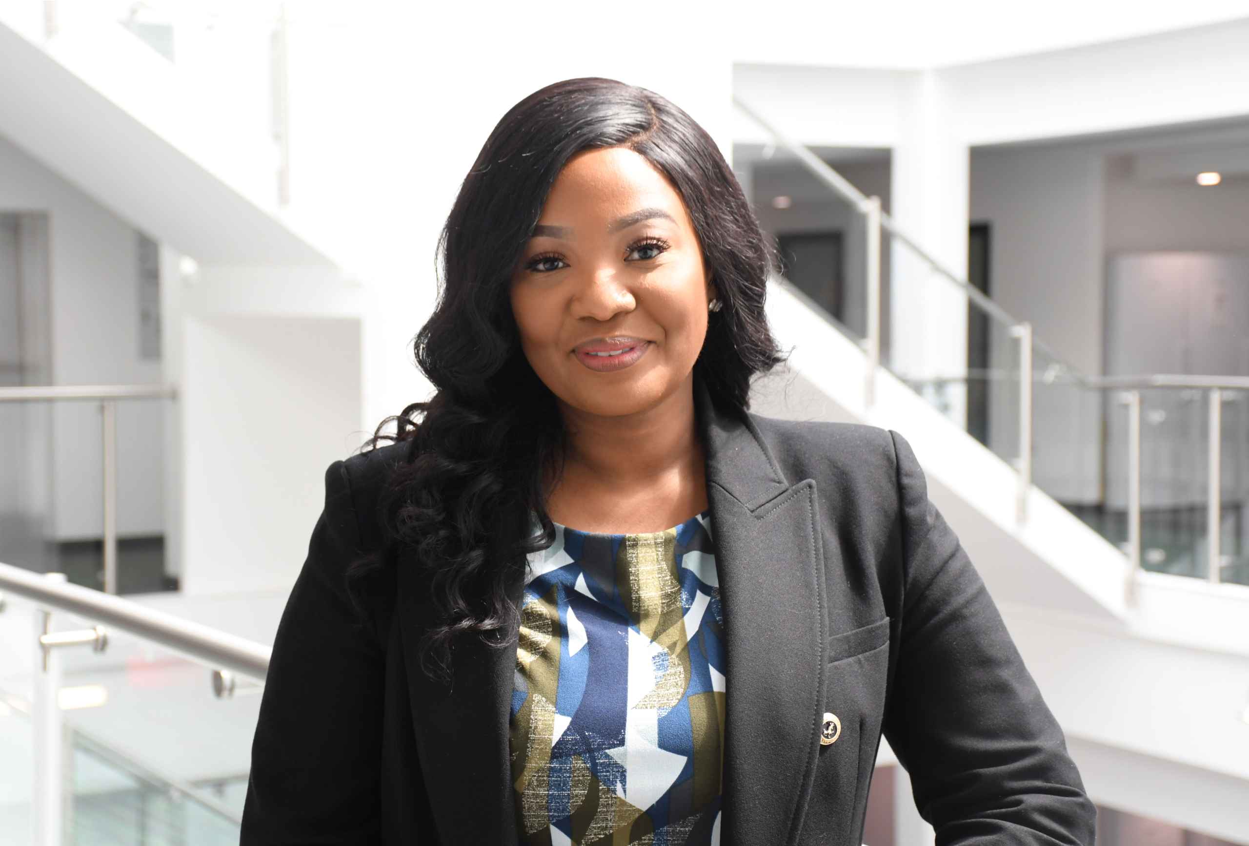 Commissioner in front of stairs