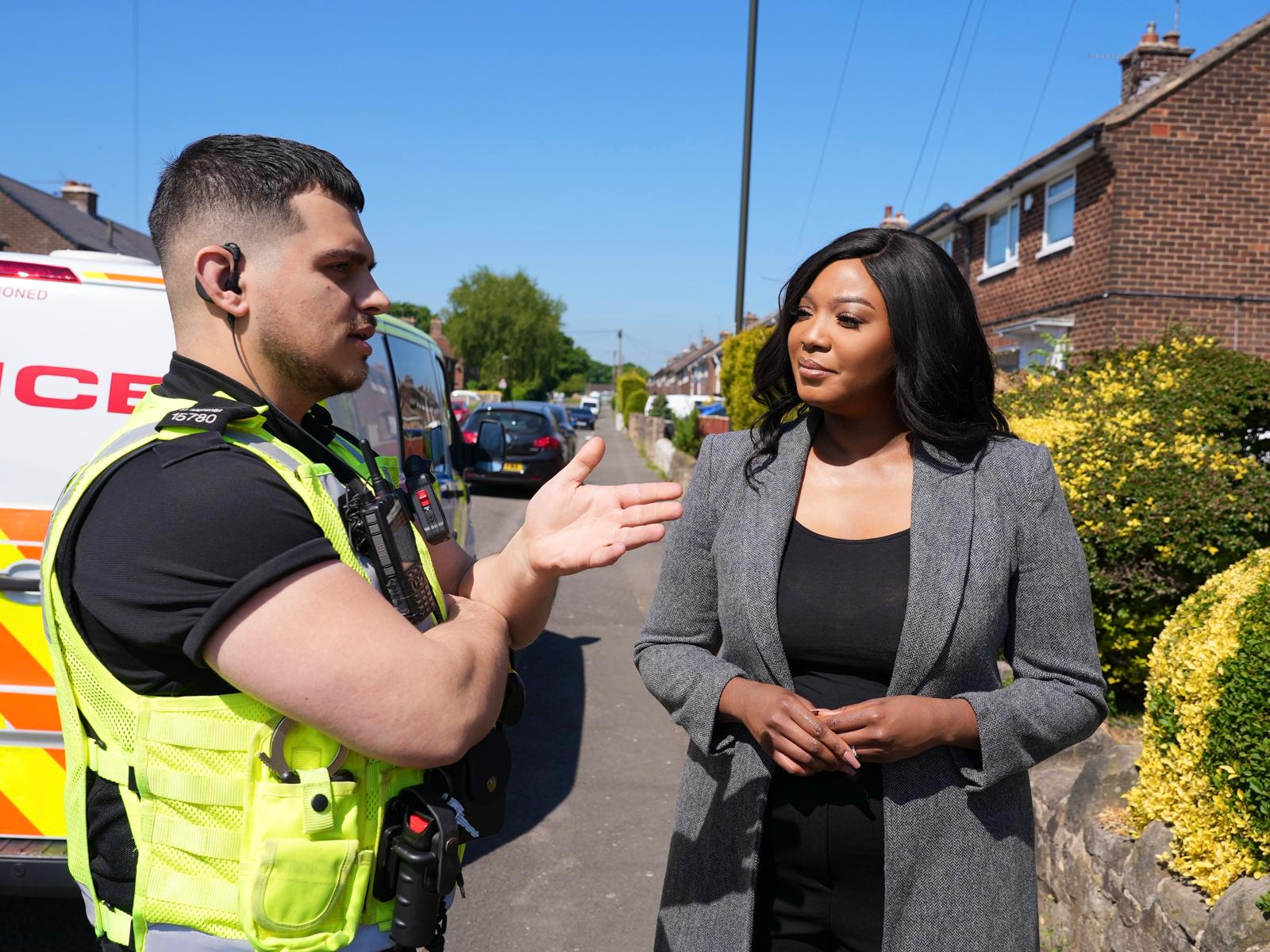 3051-NNR with local Police Officer Commissioner on street talking to a police officer