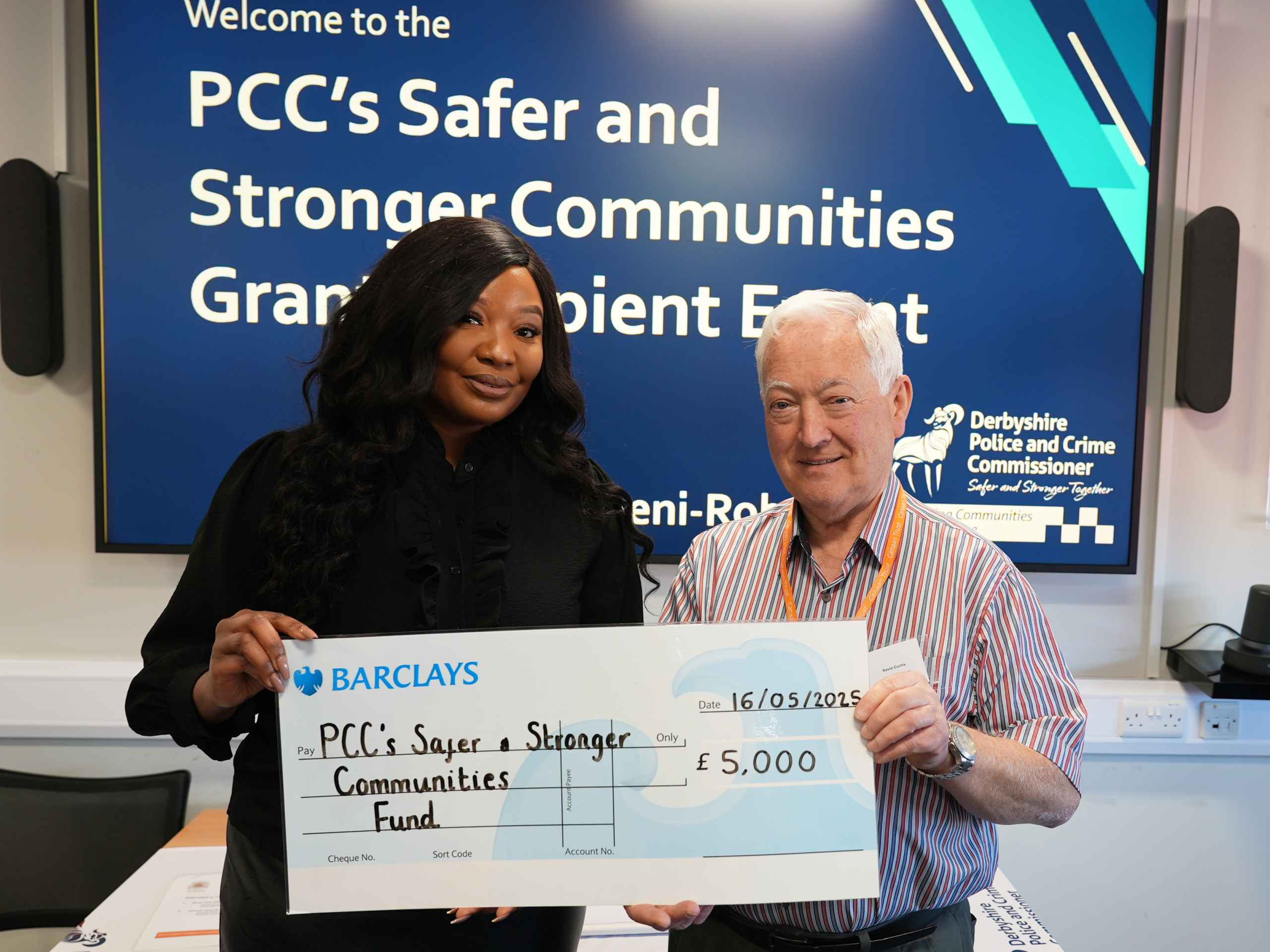 Commissioner with Kevin Curtis, Project Manager at the Canaan Trust holding large cheque for £5k