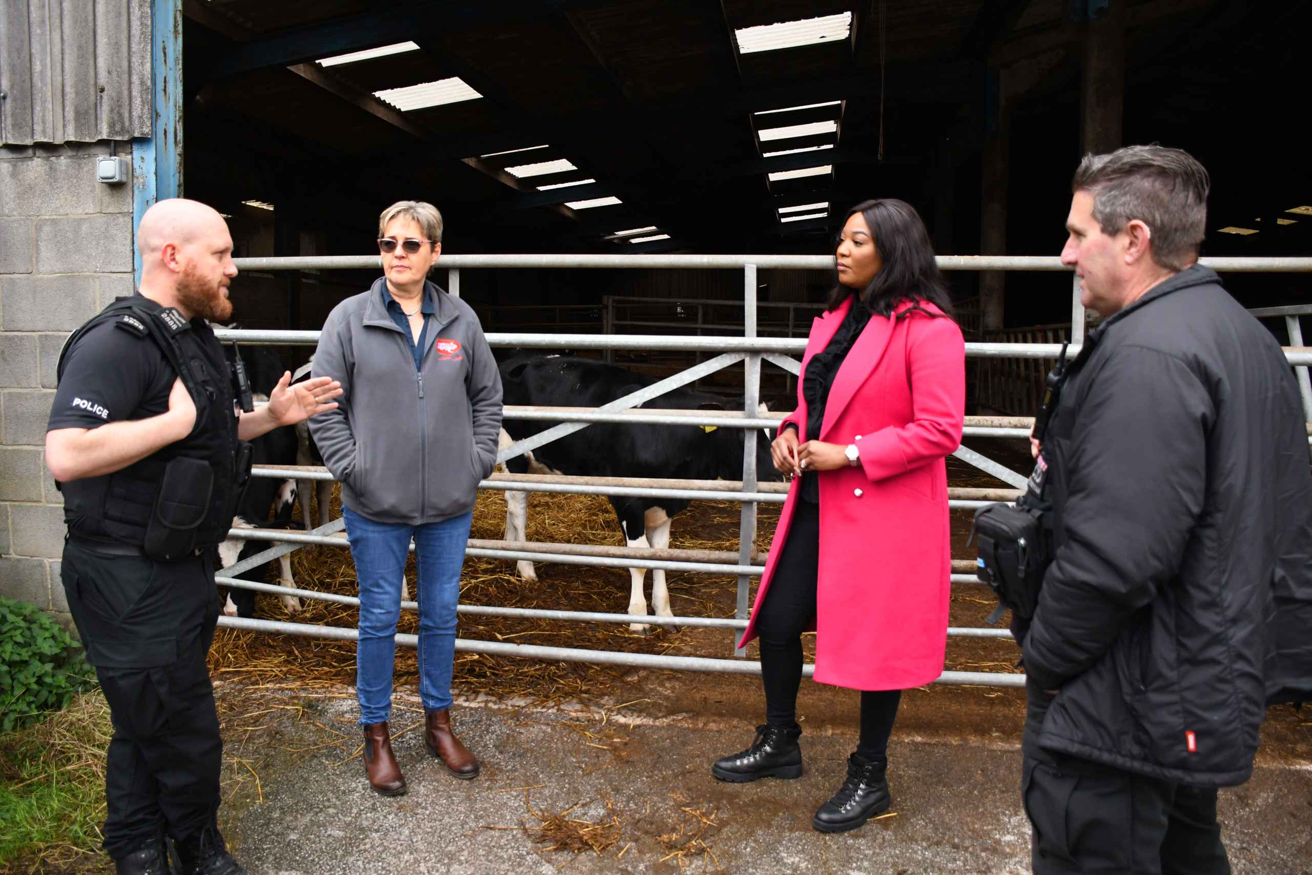 3063-Farming Life Commissioner with three people standing next to barn with cows