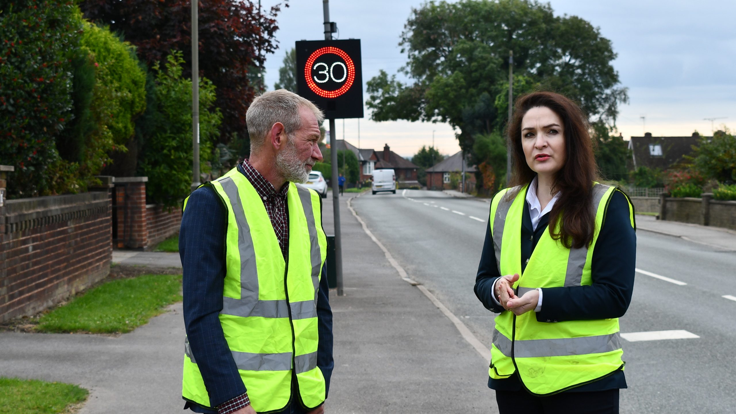 The Commissioner talks to a CSW member in front of a Speed Indicator Device
