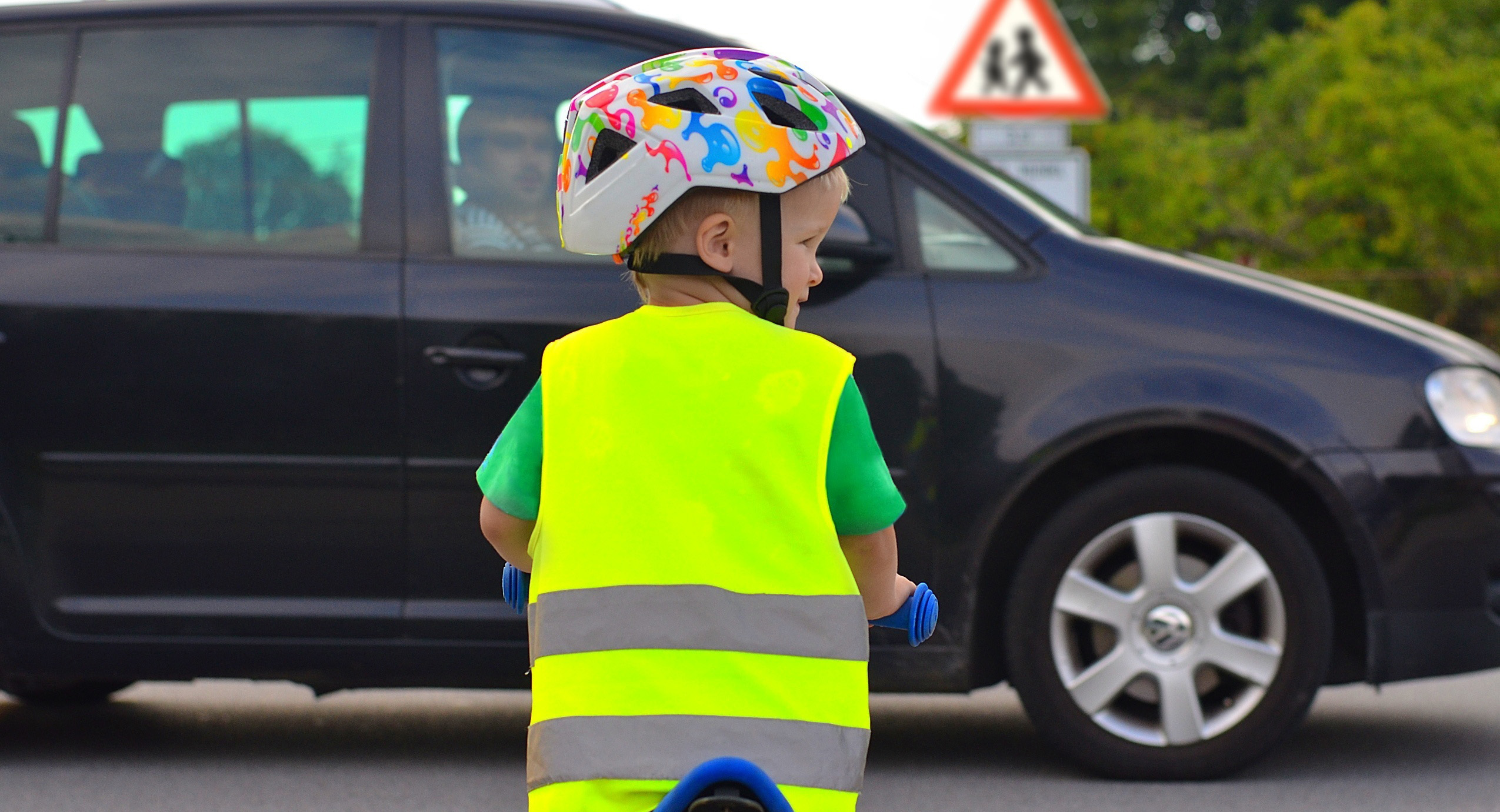 Child on bike in road