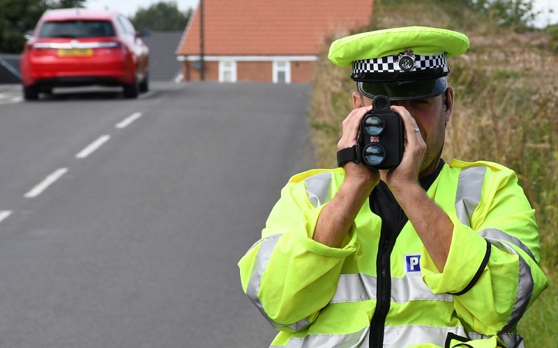 Officer with speed camera